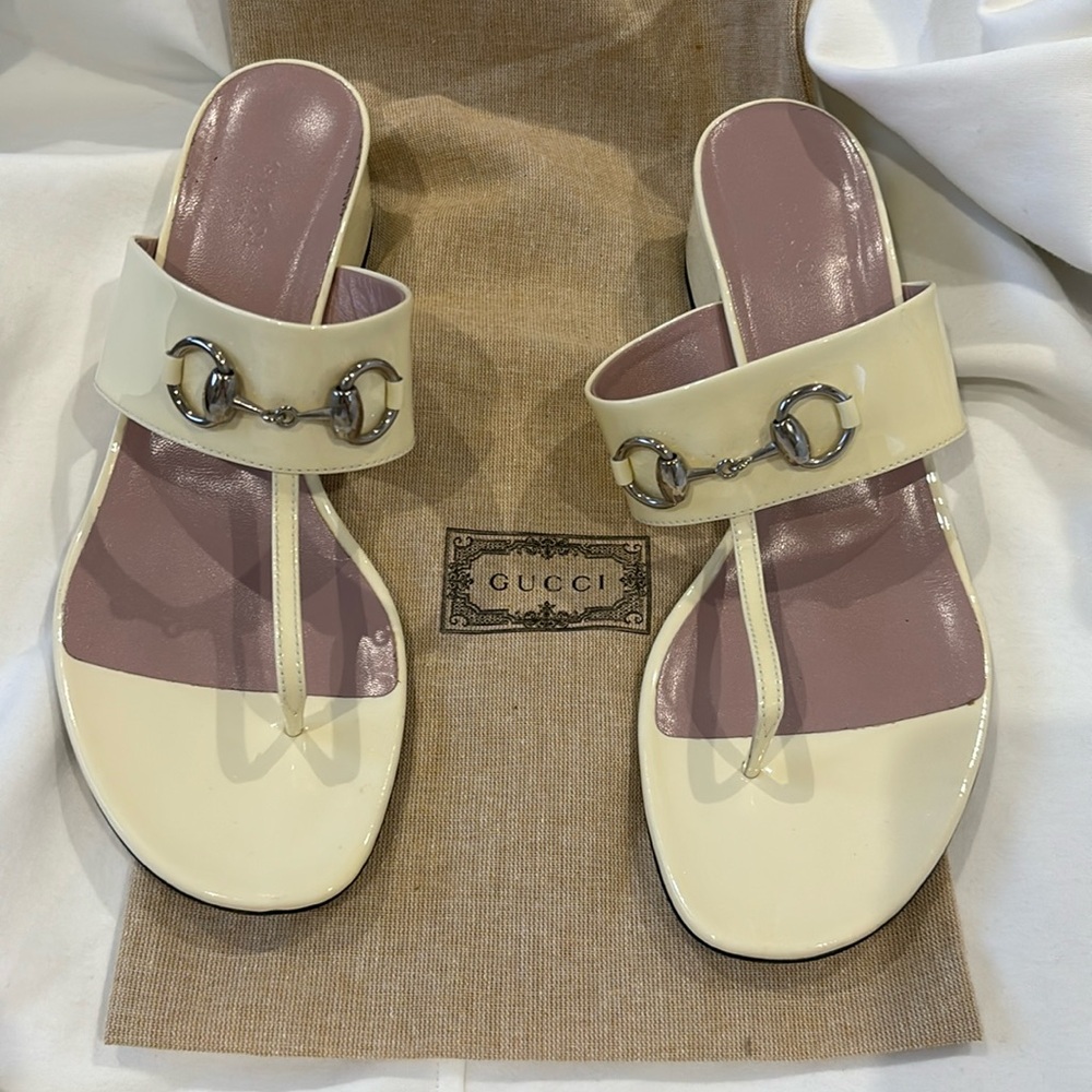 Guccis bone/ ivory patent leather sandals from Spring 2015 collection.